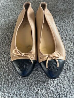 CHANEL Beige Leather Ballet Flats with Black Cap Toe and Bow